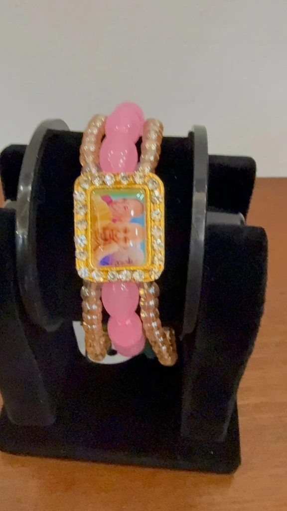 Pink bracelet with guru ji photo streachable